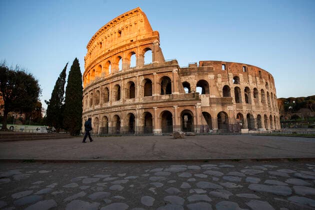 Italy: Rome sites during the Coronavirus outbreak A man walks in front of the Colosseum during the 14th day of lockdown imposed nationwide by the Italian government that tries to tackle the coronavirus outbreak. Every movements in the citiies are restricted, and streets usually filled with life and traffic are almost empty Roma Italy Italy Copyright: GiuseppexFama