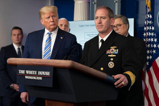 United States President Donald J. Trump, left, listens as Rear Admiral John P. Polowczyk, Vice Director, J4, Joint Staff speaks during a news briefing by members of the Coronavirus Task Force at the White House in Washington, DC on Monday, March 23, 2020. Copyright: xChrisxKleponisx