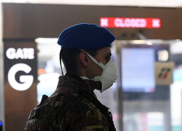 (200323) -- ROME, March 23, 2020 (Xinhua) -- An Italian soldier is on duty at Roma Termini railway station in Rome, Italy, on March 23, 2020. The COVID-19 pandemic had claimed 6,077 lives in locked down Italy by Monday, with the cumulative number of confirmed cases reaching 63,927, according to new figures released by the Civil Protection Department. (Photo by Augusto Casasoli Xinhua) ITALY-ROME-COVID-19-CASES 