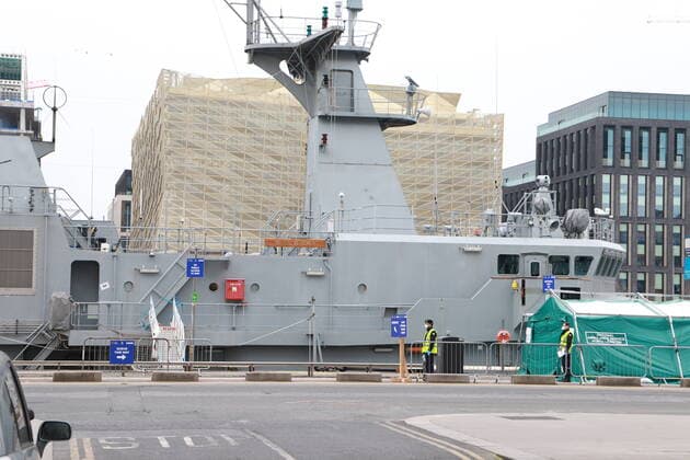 (200324) -- DUBLIN, March 24, 2020 (Xinhua) -- Photo taken on March 23, 2020 shows an Irish navy ship being transformed into a COVID-19 testing centre in Dublin, Ireland. Two more COVID-19 patients died while another 219 new coronavirus cases were confirmed in Ireland on Monday, the country s Department of Health said in a statement. To date, there have been a total of 1,125 confirmed cases of COVID-19 and six COVID-19-related deaths in the country, said the statement, adding that the latest two victims of the disease are both male from the east of Ireland. (Xinhua) IRELAND-DUBLIN-COVID-19-CONFIRMED CASES 