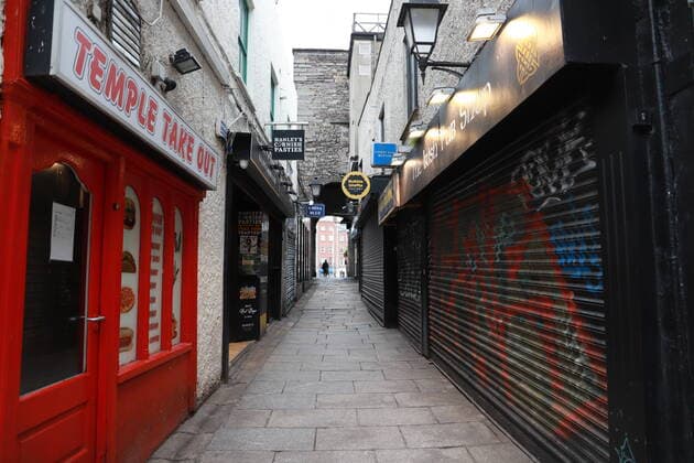 (200324) -- DUBLIN, March 24, 2020 (Xinhua) -- A street with shutdown shops is seen in downtown Dublin, Ireland, March 23, 2020. Two more COVID-19 patients died while another 219 new coronavirus cases were confirmed in Ireland on Monday, the country s Department of Health said in a statement. To date, there have been a total of 1,125 confirmed cases of COVID-19 and six COVID-19-related deaths in the country, said the statement, adding that the latest two victims of the disease are both male from the east of Ireland. (Xinhua) IRELAND-DUBLIN-COVID-19-CONFIRMED CASES