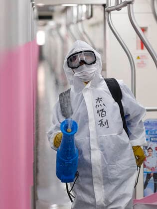 (200324) -- WUHAN, March 24, 2020 -- A staff member conducts disinfection on a subway train in Wuhan, central China s Hubei Province, March 23, 2020. The public need to go through real-name registration for taking public transportation or taxis in Wuhan, capital of central China s Hubei Province, authorities said Sunday. ) CHINA-HUBEI-WUHAN-PUBLIC TRANSPORTATION SYSTEM-PREPARATION-OPERATION RESTORATION (CN) ShenxBohan 