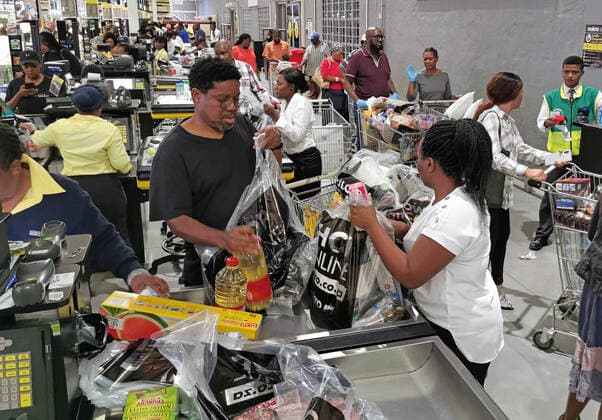 (200324) -- JOHANNESBURG, March 24, 2020 -- People shop in a supermarket in Johannesburg, South Africa, March 23, 2020. As cases of COVID-19 passed the 400 mark on Monday, South African President Cyril Ramaphosa said a countrywide lockdown would be implemented on Thursday. The 21-day lockdown would last until April 16, the president announced in Pretoria. ) SOUTH AFRICA-JOHANNESBURG-COVID-19 ChenxCheng 