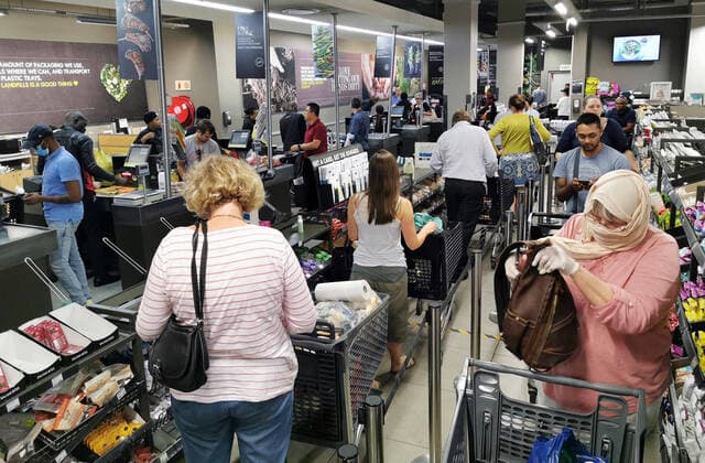 (200324) -- JOHANNESBURG, March 24, 2020 -- People shop in a supermarket in Johannesburg, South Africa, March 23, 2020. As cases of COVID-19 passed the 400 mark on Monday, South African President Cyril Ramaphosa said a countrywide lockdown would be implemented on Thursday. The 21-day lockdown would last until April 16, the president announced in Pretoria. ) SOUTH AFRICA-JOHANNESBURG-COVID-19 ChenxCheng 