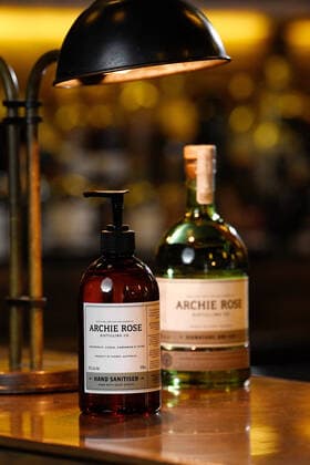 ARCHIE ROSE HAND SANITISER, A bottle of the new Archie Rose Distilling gin-infused hand sanitiser (left) is seen in Sydney, Tuesday, March 24, 2020. Using leftover botanicals from their gin, the idea to produce the hand sanitiser came from trying to keep their bar staff employed during the COVID-19 shut down of license venues. The hand sanitiser has so far sold out online, but will be sold to the general public and wholesalers. ( NO ARCHIVING, EDITORIAL USE ONLY, NO USE IN BOOKS WITHOUT CONSENT SYDNEY NSW AUSTRALIA  Copyright: xBIANCAxDExMARCHIx 20200324001459062405