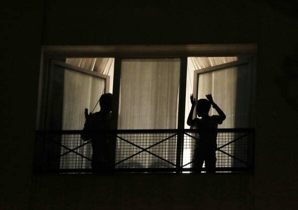 (200324) -- PARIS, March 24, 2020 -- Residents applaud to pay tribute to medical staff in Paris, France, March 23, 2020. As of Monday, France has detected 19,856 cases of coronavirus infection, and 860 people had died from COVID-19, French Health Minister Olivier Veran announced at a daily update. In the last 24 hours, 3,176 more people were diagnosed with the virus, which claimed 186 new lives. ) FRANCE-PARIS-CORONAVIRUS-TRIBUTE TO MEDICAL STAFF GaoxJing
