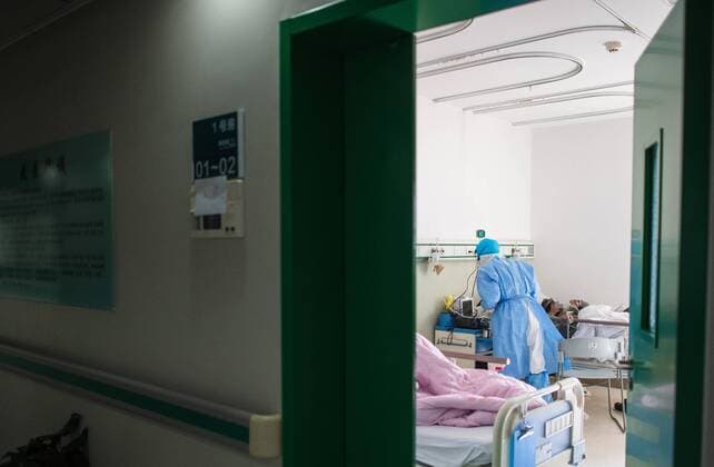 (200324) -- BEIJING, March 24, 2020 -- A medical staff member works in the isolation ward at Wuhan No.1 Hospital in Wuhan, central China s Hubei Province, Feb. 22, 2020. ) Xinhua Headlines: Wuhan provides hope in fight against COVID-19 XiaoxYijiu 