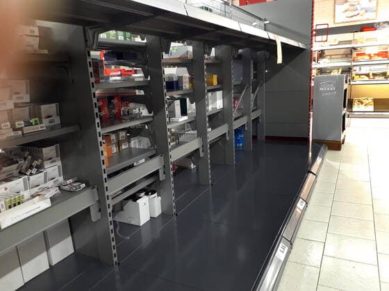 Shopping at a discount store in the Hanover area Empty shelves for hygiene products such as toilet paper and kitchen rolls Purchasing