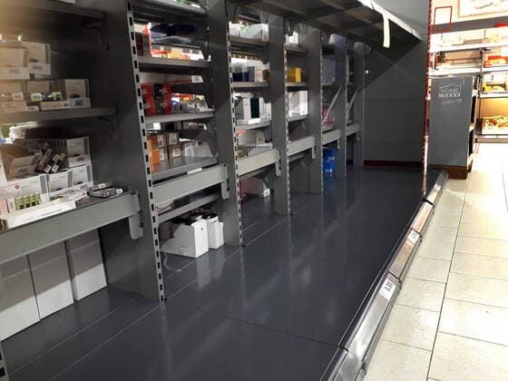 Shopping at a discount store in the Hanover area Empty shelves for hygiene products such as toilet paper and kitchen rolls Purchasing
