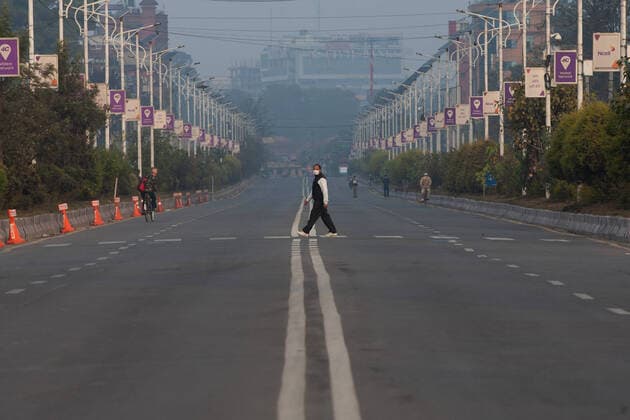 Nepal: First day of lockdown in Kathmandu A man wearing a face mask walks across an empty road during a Lock down in Kathmandu,Nepal on 24 March,2020. Nepal government has decided to lock down the whole country from 24 March 6AM local time to till 31 March 6AM following a second confirmed COVID-19 case. kathmandu katmandu Nepal Kathmandu Copyright: PrabinxRanabhat