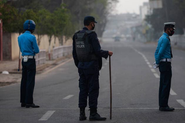 March 24, 2020, Kathmandu, Nepal: Nepal police officers stand on guard on a deserted road during the lock down as a preventive measure against the spread of Coronavirus..Nepal government has decided to lock down the whole country from 24 March till 31 March following a second confirmed COVID-19 case. Kathmandu Nepal - ZUMAs197 20200324_zaa_s197_020 Copyright: xPrabinxRanabhatx