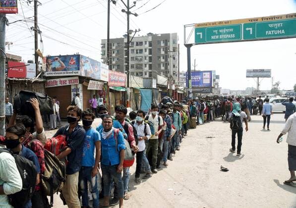 PATNA, INDIA - MARCH 23: Passengers queue to board buss during the first day of lockdown imposed by the state government to curb the spread of coronavirus on March 23, 2020 in Patna, India. (Photo Santosh Kumar Hindustan Times) First day Of Lockdown In Patna