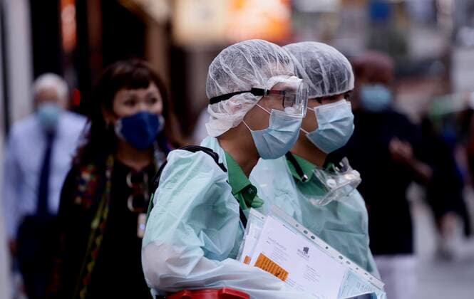 March 24, 2020, Hong Kong, CHINA: Sanitizing Team from the private firm in the financial centre in Central, Hong Kong.Mar-24,2020 Hong Kong.ZUMA Hong Kong CHINA - ZUMAl137 20200324_zap_l137_002 Copyright: xLiauxChung-renx
