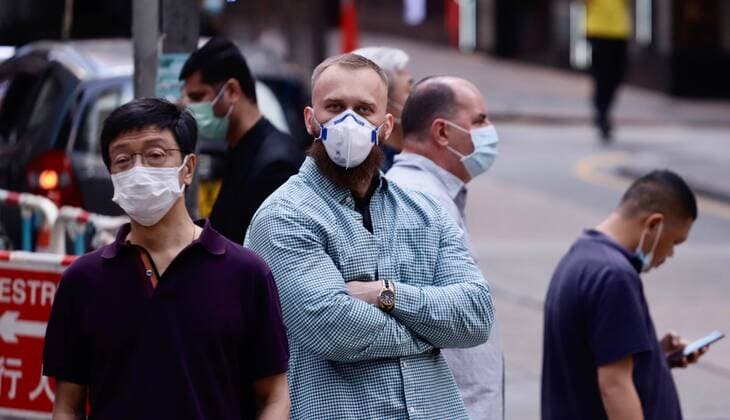 March 24, 2020, Hong Kong, CHINA: Westerners wearing face masks to keep off coronavirus infections in the financial district in Central Hong Kong.Mar-24,2020 Hong Kong.ZUMA Hong Kong CHINA - ZUMAl137 20200324_zap_l137_007 Copyright: xLiauxChung-renx
