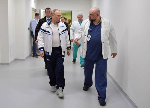 MOSCOW, RUSSIA - MARCH 24, 2020: Chief physician Denis Protsenko shows round Russia s President Vladimir Putin (R-L front) on his visit to the Novomoskovsky multipurpose medical center for patients suspected of the COVID-19 coronavirus infection. Alexei Druzhinin Russian Presidential Press and Information Office TASS  TS0D336D