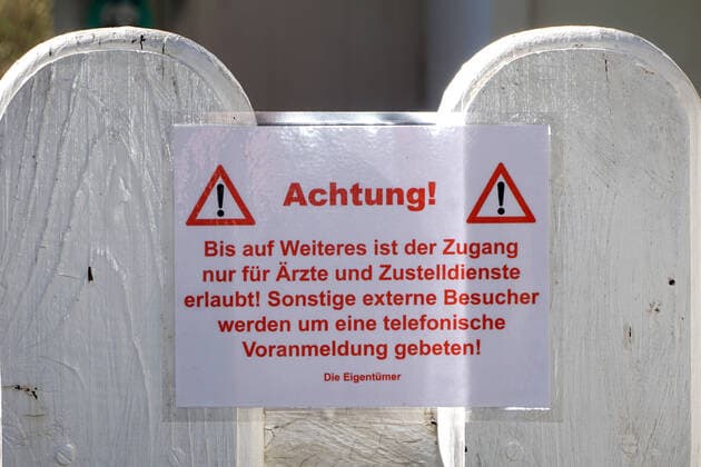 Fear of coronavirus At the gate as access to a private property is a laminated sign with the indication that only doctors and delivery services are allowed the way to the home Essen Nordrhein Westfalen Germany