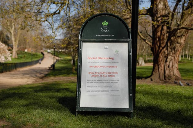 (200324) -- LONDON, March 24, 2020 -- A sign encouraging social distancing is seen in Hyde Park after the British government placed further restrictions on movement in London, Britain on March 24, 2020. British Prime Minister Boris Johnson announced Monday evening a series of measures that aim to restrict social contact in the UK, so as to curb the spread of COVID-19. Starting from Monday night, people in Britain will only be allowed to leave their homes for very limited purposes , including shopping for basic necessities, for any medical need, for one form of exercise a day, and to travel to and from work when necessary, said the prime minister. (Photo by Tim Ireland Xinhua) BRITAIN-LONDON-COVID-19 HanxYan 