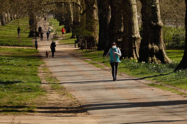 (200324) -- LONDON, March 24, 2020 -- A woman exercises in Hyde Park after the British government placed further restrictions on movement in London, Britain on March 24, 2020. British Prime Minister Boris Johnson announced Monday evening a series of measures that aim to restrict social contact in the UK, so as to curb the spread of COVID-19. Starting from Monday night, people in Britain will only be allowed to leave their homes for very limited purposes , including shopping for basic necessities, for any medical need, for one form of exercise a day, and to travel to and from work when necessary, said the prime minister. (Photo by Tim Ireland Xinhua) BRITAIN-LONDON-COVID-19 HanxYan 