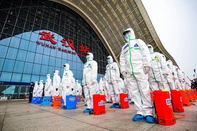 (200324) -- WUHAN, March 24, 2020 -- Firefighters gather to prepare for disinfection works at the Wuhan Railway Station in Wuhan, central China s Hubei Province, March 24, 2020. Over 70 firefighters conducted a comprehensive disinfection at the railway station on Tuesday. (Photo by Xinhua) CHINA-HUBEI-WUHAN-RAILWAY STATION-DISINFECTION (CN) HexHanqiu 