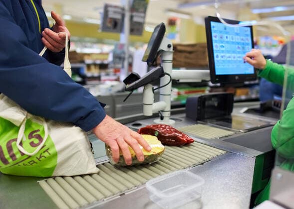 Supermarket in Marktoberdorf, March 24, 2020. A cashier in a grocery store remembers to keep distance between customers due to the Corona virus disease (COVID-19) on March 24, 2020 in Marktoberdorf, Germany