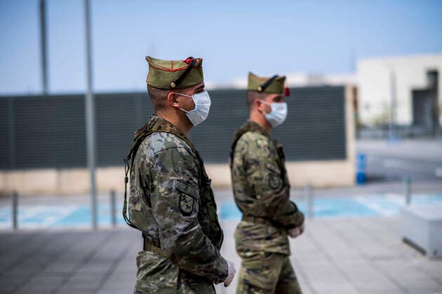 March 24, 2020, Granada, Spain: Members of the Spanish Army Legion patrolling the San Cecilio clinical hospital wearing face masks as a preventive measure, during the covid-19 pandemic..After 11 days of the state of emergency in Spain due to the coronavirus outbreak, there are more than 29,900 infected and 2,700 deaths. Granada Spain - ZUMAs197 20200324_zaa_s197_044 Copyright: xCarlosxGilx