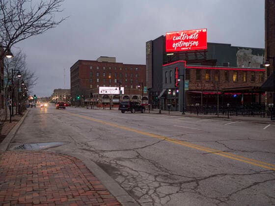 March 24, 2020, Des Moines, Iowa, U.S: A public service announcement about the coronavirus on an electronic billboard in the historic district of downtown Des Moines. Des Moines was virtually deserted Tuesday as many people chose to stay in their homes. On Tuesday morning, 24 March, Iowa reported over 120 confirmed cases of the Coronavirus (SARS-CoV-2) and COVID-19. Restaurants, bars, movie theaters, places that draw crowds are closed for at least 30 days. The Governor has not ordered shelter in place but several Mayors, including the Mayor of Des Moines, have asked residents to stay in their homes for all but the essential needs. People are being encouraged to practice social distancing and many businesses are requiring or encouraging employees to telecommute. Des Moines U.S. - ZUMAk94_ 20200324_zaf_k94_002 Copyright: xJackxKurtzx
