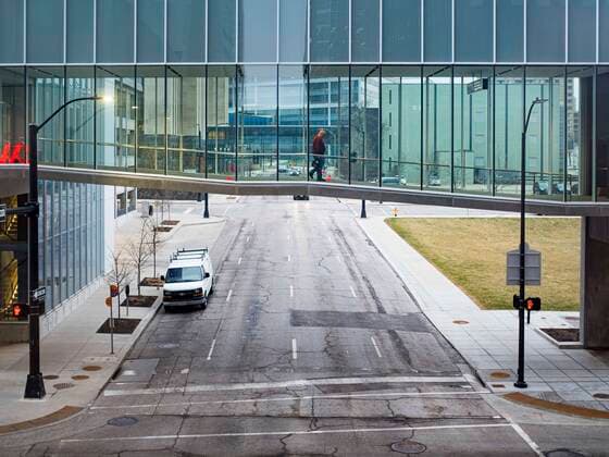 March 24, 2020, Des Moines, Iowa, U.S: A solitary person walks through the Des Moines skywalk. The city was deserted Tuesday as most people chose to work from home or stay in their homes. On Tuesday morning, 24 March, Iowa reported over 120 confirmed cases of the Coronavirus (SARS-CoV-2) and COVID-19. Restaurants, bars, movie theaters, places that draw crowds are closed for at least 30 days. The Governor has not ordered shelter in place but several Mayors, including the Mayor of Des Moines, have asked residents to stay in their homes for all but the essential needs. People are being encouraged to practice social distancing and many businesses are requiring or encouraging employees to telecommute. Des Moines U.S. - ZUMAk94_ 20200324_zaf_k94_013 Copyright: xJackxKurtzx