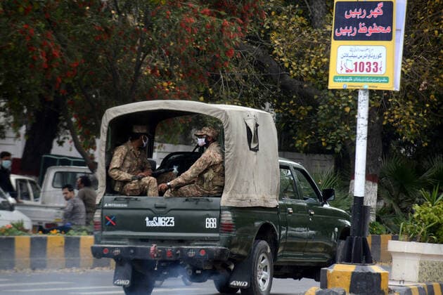 (200324) -- LAHORE, March 24, 2020 -- Pakistani army soldiers patrol during lockdown in eastern Pakistan s Lahore on March 24, 2020. Pakistan on Monday announced to lock down east Punjab province hours after locking down south Sindh province to curb the spread of COVID-19 after the number of infected patients rose above 800 across the country, officials said. (Photo by Xinhua) PAKISTAN-LAHORE-LOCKDOWN Sajjad 