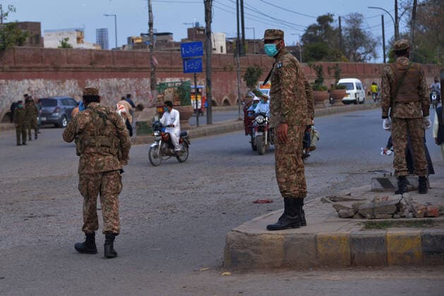 Pakistani army and ranger officials patrolling Pakistani army and ranger officials are patrolling high alert during the complete lockdown due to increasing coronavirus cases in country, as preventive measure against the spread of the Coronavirus (COVID- 19) in Lahore. Pakistan on Tuesday reported its seventh death from the novel coronavirus in the country and 16 new cases taking the nationwide toll of positive cases to 908. Pakistani authorities said they d shut down train, bus operations across the country until March 31 in an effort to contain the spread of the virus. Lahore Punjab Pakistan Copyright: RanaxSajidxHussain