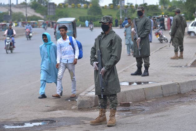 Pakistani army and ranger officials patrolling Pakistani army and ranger officials are patrolling high alert during the complete lockdown due to increasing coronavirus cases in country, as preventive measure against the spread of the Coronavirus (COVID- 19) in Lahore. Pakistan on Tuesday reported its seventh death from the novel coronavirus in the country and 16 new cases taking the nationwide toll of positive cases to 908. Pakistani authorities said they d shut down train, bus operations across the country until March 31 in an effort to contain the spread of the virus. Lahore Punjab Pakistan Copyright: RanaxSajidxHussain