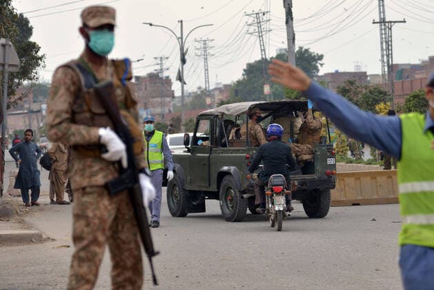 Pakistani army and ranger officials patrolling Pakistani army and ranger officials are patrolling high alert during the complete lockdown due to increasing coronavirus cases in country, as preventive measure against the spread of the Coronavirus (COVID- 19) in Lahore. Pakistan on Tuesday reported its seventh death from the novel coronavirus in the country and 16 new cases taking the nationwide toll of positive cases to 908. Pakistani authorities said they d shut down train, bus operations across the country until March 31 in an effort to contain the spread of the virus. Lahore Punjab Pakistan Copyright: RanaxSajidxHussain