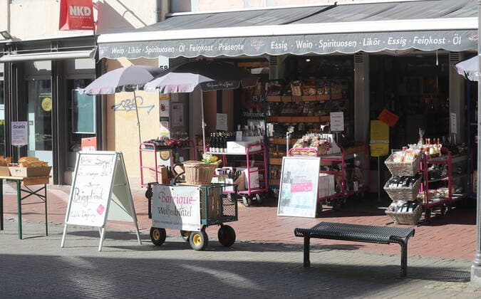 Almost deserted downtown Wolfenbuettel, view into the Lange Herzog Strasse, pedestrian zone, this grocery store is open Wolfenbuettel