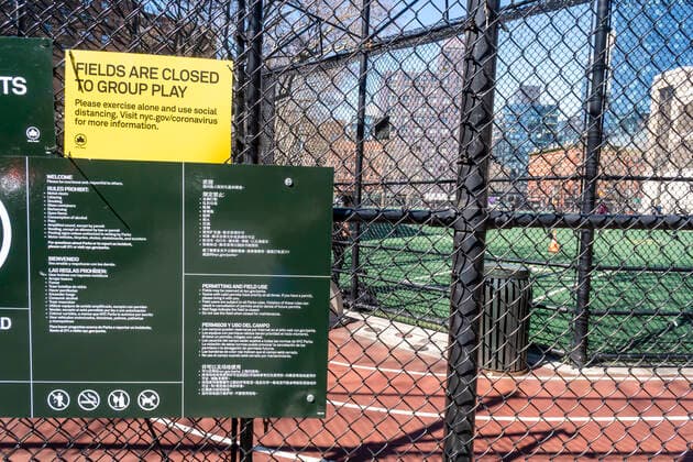 Coronavirus pandemic in New York People engage in social distancing in an athletic field in Chelsea Park in New York on Tuesday, March 24, 2020. In order to facilitate social distancing athletic fields have been closed to group activities and the city is encouraging users of playgrounds to avoid them if they are crowded.(  RichardxB.xLevine