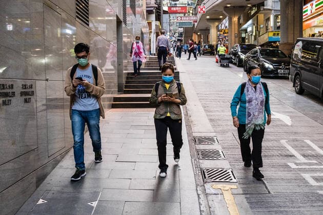 March 24, 2020, Hong Kong, China: People wearing face masks as a preventive measure during the corona virus pandemic..As the coronavirus outbreak worsens, routine continues for businessmen and residents around the city, people wear face masks in fear of contracting the virus. Hong Kong China - ZUMAs197 20200324_zaa_s197_112 Copyright: xWilliexSiaux