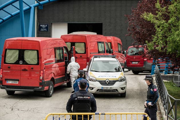March 24, 2020, Madrid, Spain: Spanish army red vans arriving at Palacio de Hielo with corpses of those killed by the virus..The ice rink of Palacio de Hielo mall (Ice Palace) is used by the Spanish Army as a morgue due to local funeral homes being over capacitated due to COVID-19. Spain plans to continue its quarantine measures at least through April 11. Madrid Spain - ZUMAs197 20200324_zaa_s197_099 Copyright: xBraisxGonzalezxRoucox