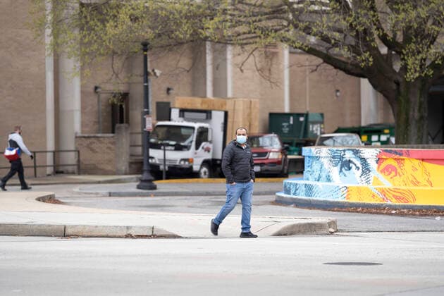March 24, 2020, Washinton, District of Columbia, USA: A man wearing a mask walks on 23rd Street NW on Tuesday, March 24, 2020, in Washington, District of Columbia. Washinton USA - ZUMAg214 20200324_znp_g214_021 Copyright: xSaitxSerkanxGurbuzx