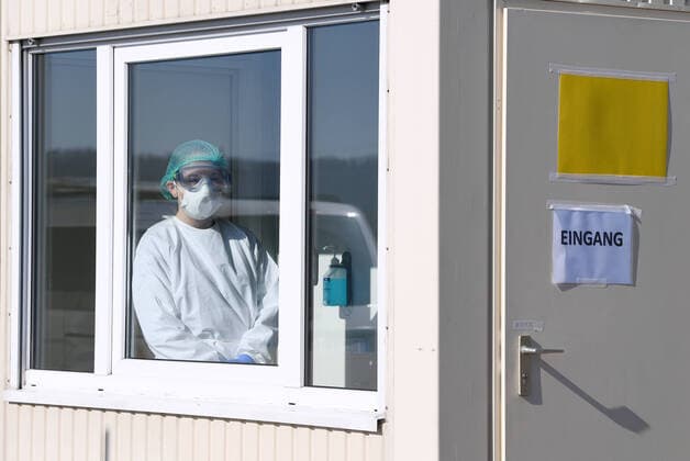 Tuebingen 24 03 2020 Corona Container Outpatient Clinic Tuebingen, Covid 19 Care at the Tuebingen fairground A medical student is waiting in a container for patients for outpatient care ULMER