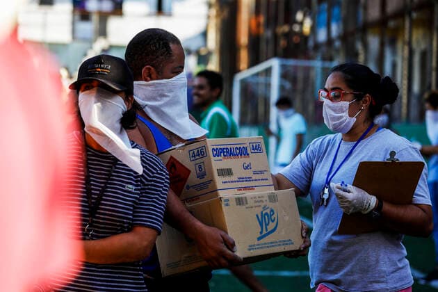 March 24, 2020, Sao Paulo, SP, Brazil: Residents of the PARAISOPOLIS slum in the Sao Paulo city received medical orientations about coronavirus prevention. The initiative organized by the residents association distributed too protection masks, soap and alcohol gel. Sao Paulo Brazil - ZUMAc168 20200324_zap_c168_005 Copyright: xMarceloxChellox