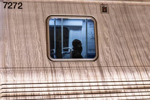 March 24, 2020, Washington, DC, UNITED STATES: A passenger wearing his scarf around his face sits on a metro in mid day in Washington, DC on Tuesday, March 24, 2020. To date the United States has 52,966 Corona Virus cases and 685 deaths. President Donald Trump says he wants the nation opened up and just raring to go by Easter -- a date just more than two weeks away that few health experts believe will be sufficient in containing the spread of coronavirus. Washington UNITED STATES - ZUMAc206 20200324_zap_c206_007 Copyright: xKenxCedenox
