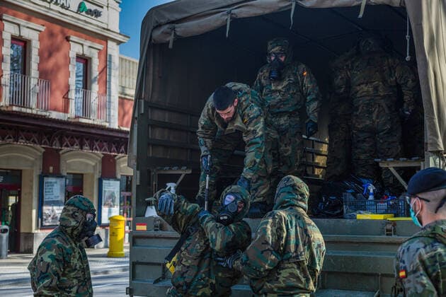 March 24, 2020, San Sebastian, Basque Country, Spain: Soldiers in protective suits as a preventive measure arrive for the disinfection work during the corona virus pandemic..62 soldiers from the Spanish Army disinfected the San Sebastian train station in the Basque County, as a preventive measure against the spread of the coronavirus San Sebastian Spain - ZUMAs197 20200324_zaa_s197_145 Copyright: xJavixJuliox