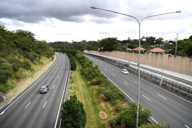 AUSTRALIA CORONAVIRUS COVID-19, Light traffic is seen on the M1 Pacific Highway during the morning peak hour in Brisbane, Wednesday, March 25, 2020. A shutdown of non-essential services as well as domestic and international travel restrictions are in effect Australia wide in a bid to slow the spread of the COVID-19 coronavirus. ( NO ARCHIVING, EDITORIAL USE ONLY, NO USE IN BOOKS WITHOUT CONSENT BRISBANE QUEENSLAND AUSTRALIA  Copyright: xDANxPELEDx 20200325001459237251