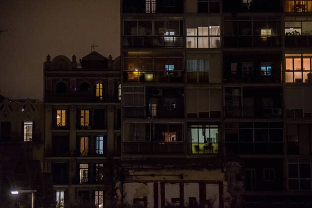 March 24, 2020, Barcelona, Catalonia, Spain: Illuminated apartments are seen in Barcelona during lockdown to slow the rate of the coronavirus disease (COVID-19) spread. SpainÃ¢â‚¬â ¢s coronavirus victims rise by 514 in a day, with 2,700 dead and nearly 40,000 infections Barcelona Spain - ZUMAb137 20200324_zap_b137_008 Copyright: xJordixBoixareux