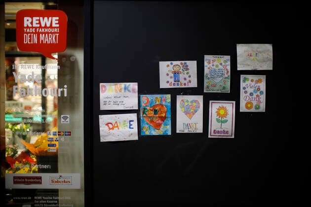 Düsseldorf, Germany, childrens drawings hanging in the entrance area of the REWE store Yade in Düsseldorf on 24 03 2020