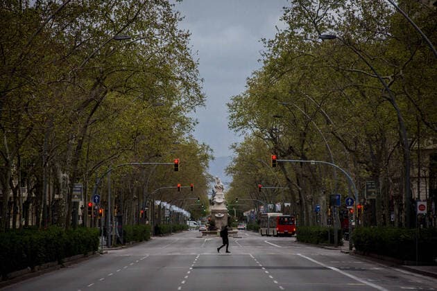 March 24, 2020, Barcelona, Catalonia, Spain: A man passes by the empty Gran Via street in Barcelona. SpainÃ¢â‚¬â ¢s coronavirus victims rise by 514 in a day, with 2,700 dead and nearly 40,000 infections Barcelona Spain - ZUMAb137 20200324_zap_b137_016 Copyright: xJordixBoixareux