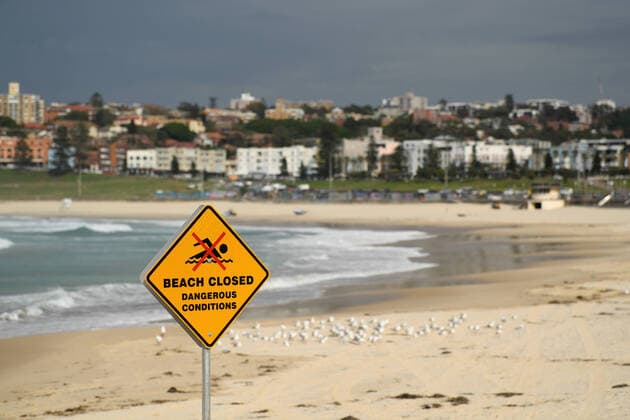 AUSTRALIA CORONAVIRUS COVID-19, Signage at the closed off Bondi Beach in Sydney, Tuesday, March 24, 2020. A shutdown of non-essential services is in effect Australia wide in a bid to slow the spread of the coronavirus (COVID-19) disease, with the state of NSW recording 818 positive tested cases. ( NO ARCHIVING, EDITORIAL USE ONLY, NO USE IN BOOKS WITHOUT CONSENT SYDNEY NSW AUSTRALIA  Copyright: xJOELxCARRETTx 20200325001459257503