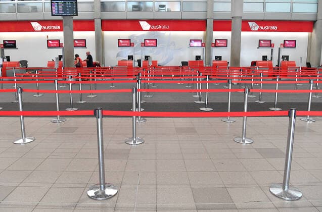 VIRGIN AUSTRALIA CORONAVIRUS IMPACT, A near empty check in counter is seen at the Virgin Australia terminal at the Brisbane domestic Airport in Brisbane, Wednesday, March 25, 2020. Virgin Australia has announced it is standing down around 8,000 of its 10,000 workers and will be cutting its domestic capacity by 90 per cent. ( NO ARCHIVING, EDITORIAL USE ONLY, NO USE IN BOOKS WITHOUT CONSENT BRISBANE QLD AUSTRALIA  Copyright: xDARRENxENGLANDx 20200325001459259166