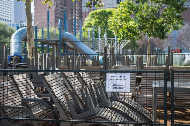 March 24, 2020, Houston, Texas, USA: Maintenance workers put up signs and fence off playgrounds and furniture at DISCOVERY GREEN in downtown Houston, Texas, Tuesday, March 24, 2020. A Stay Home - Work Safe Order was issued Tuesday for Houston and Harris County residents to help fight the spread of COVID-19. The order will go into effect at 11:59 p.m. and will last until April 3. Houston USA - ZUMAp213 20200324_znp_p213_002 Copyright: xLynnxPenningtonx