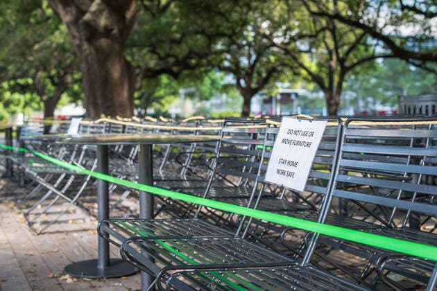 March 24, 2020, Houston, Texas, USA: Maintenance workers put up signs and fence off playgrounds and furniture at DISCOVERY GREEN in downtown Houston, Texas, Tuesday, March 24, 2020. A Stay Home - Work Safe Order was issued Tuesday for Houston and Harris County residents to help fight the spread of COVID-19. The order will go into effect at 11:59 p.m. and will last until April 3. Houston USA - ZUMAp213 20200324_znp_p213_005 Copyright: xLynnxPenningtonx