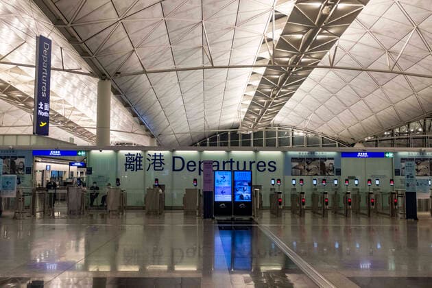 March 25, 2020, Hong Kong, China: Airport staffs members wearing face masks as a precaution against the spread of Coronavirus sit at the Departure Hall of the Hong Kong International airport..Temporally 14 days new measures in response to the latest situation of COVID-19 started on March 25, 2020, including compulsory quarantine for HK residents; Stop entry for non-Hong Kong residents from overseas and suspend all transit services along with limited service provided from the airport shops and restaurants. Hong Kong China - ZUMAs197 20200325_zaa_s197_013 Copyright: xMayxJamesx