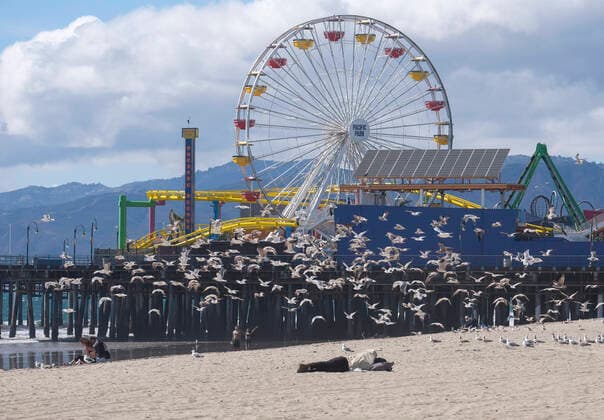March 24, 2020, Los Angeles, California, U.S: Seagulls fly in Santa Monica Beach on Tuesday, March 24, 2020. California Gov. Gavin Newsom issued a statewide stay-at-home order Thursday for residents to venture outside only for essential jobs, errands and some exercise, due to coronavirus concerns. Los Angeles U.S. - ZUMAc68_ 20200324_zaf_c68_004 Copyright: xRingoxChiux